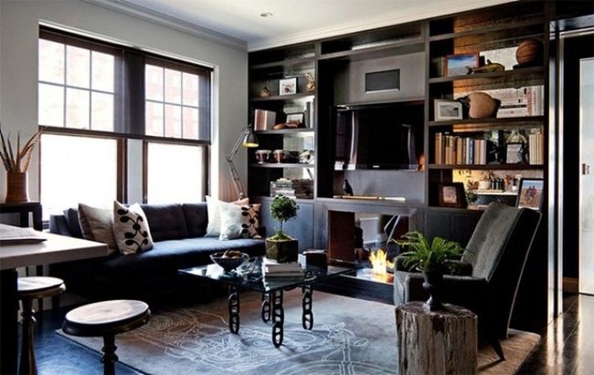 Sunlit Space With Dark Wood And Black Couches