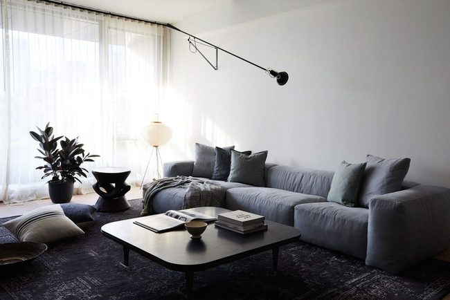 Oversized Rugs Define Room Proportions