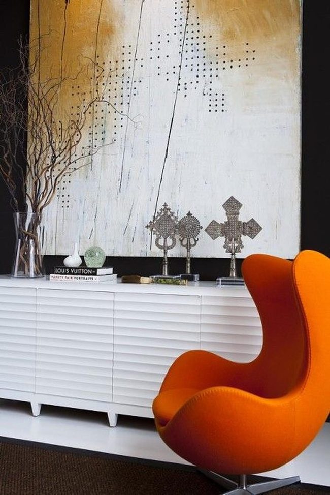 Orange Chair, White Storage, Gold Accents