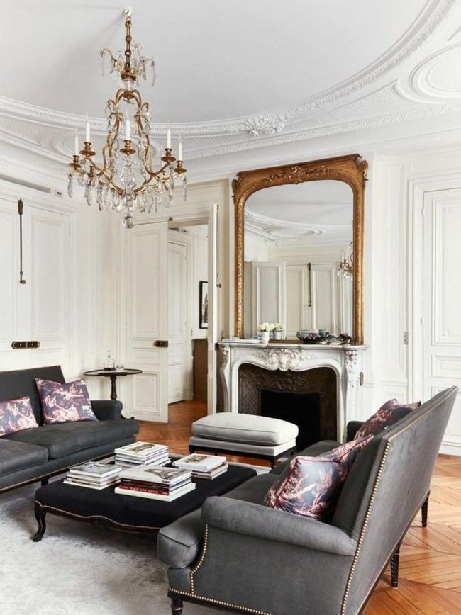 Gold Mirrors Above Marble Fireplace