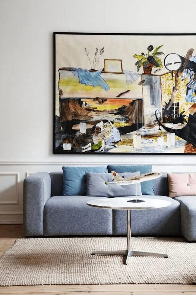 Light Blue Sofa With Colorful Wall Art