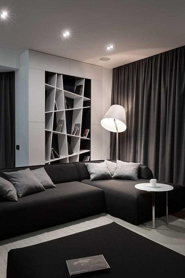 Black Sofa With Angled Bookshelf Display