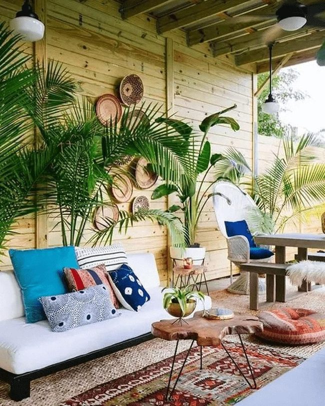 White Sofas, Colorful Pillows, Wood Walls