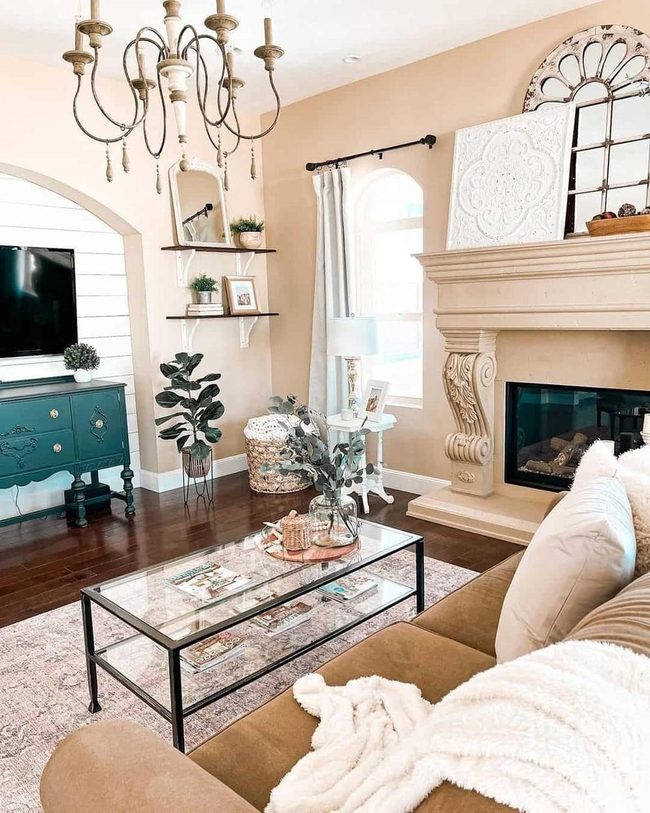 Ornate Chandelier Frames Classical Fireplace
