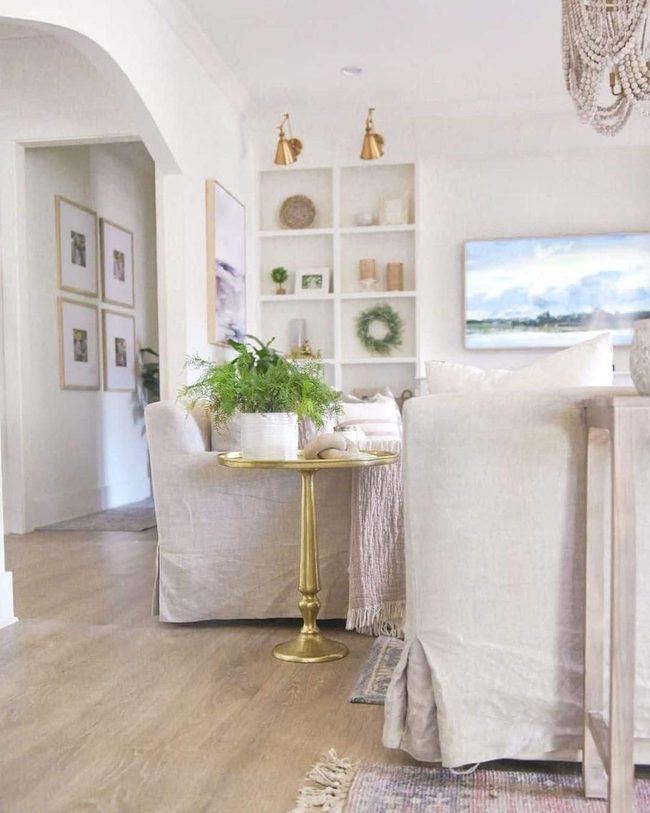 Gold Round Table Brightens White Rooms