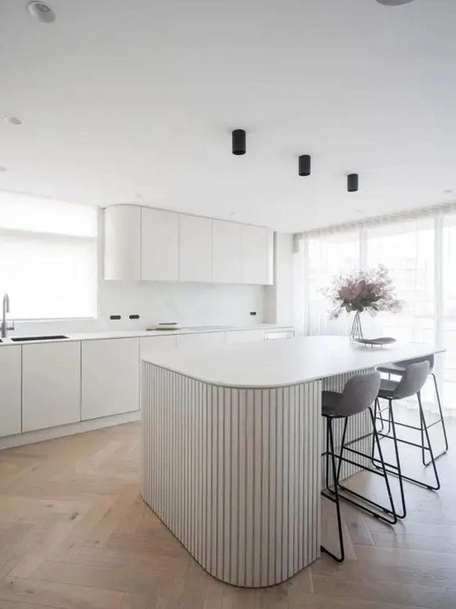 Curved Island Meets Warm Wood Kitchen