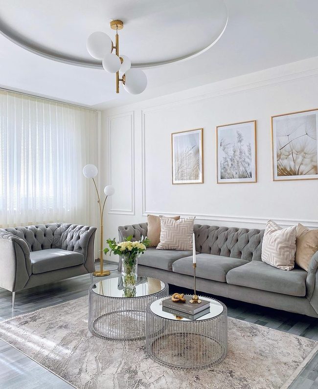 Gray Tufted Sofa With Glass Reflection