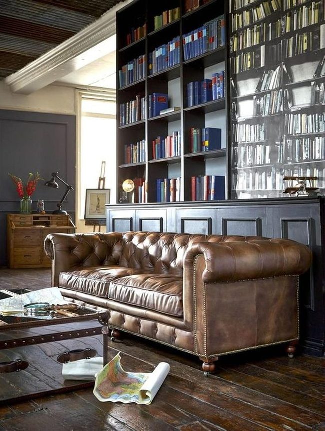 Leather, Dark Wood, And Towering Books