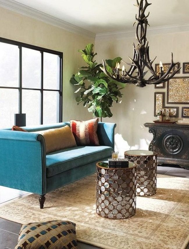 Blue Couch Meets Antler Chandeliers