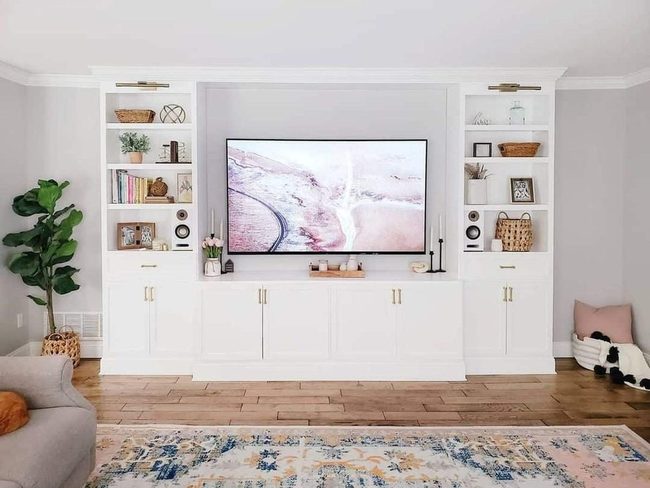 White Cabinetry Conceals Living Room Clutter
