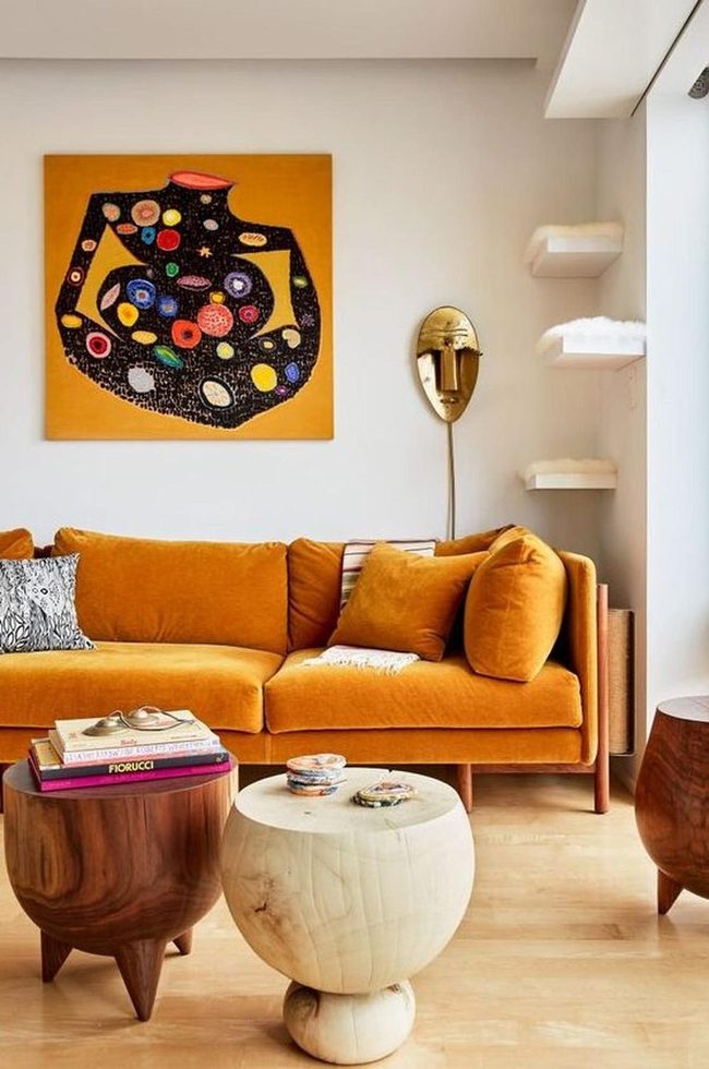 Orange Couch With Abstract Art