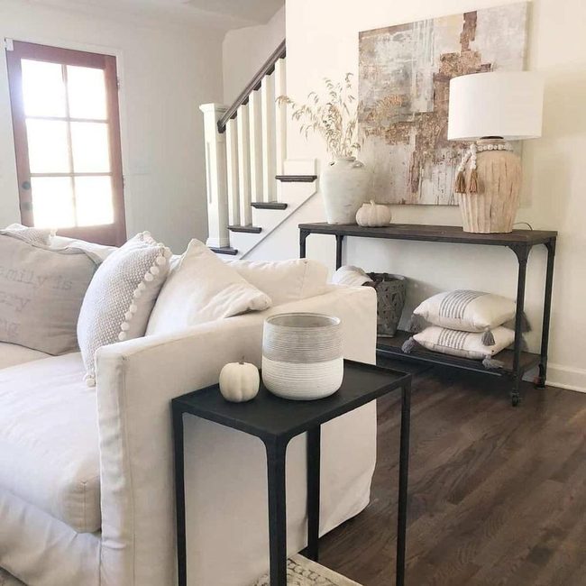 Beige Slipcovered Couch With Black Accents