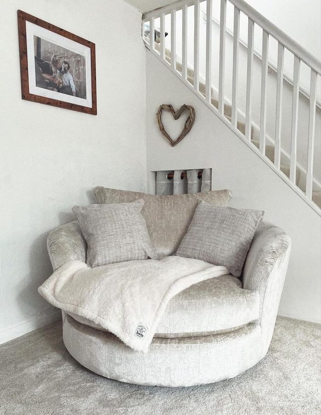 Plush Reading Nook Under Stairs