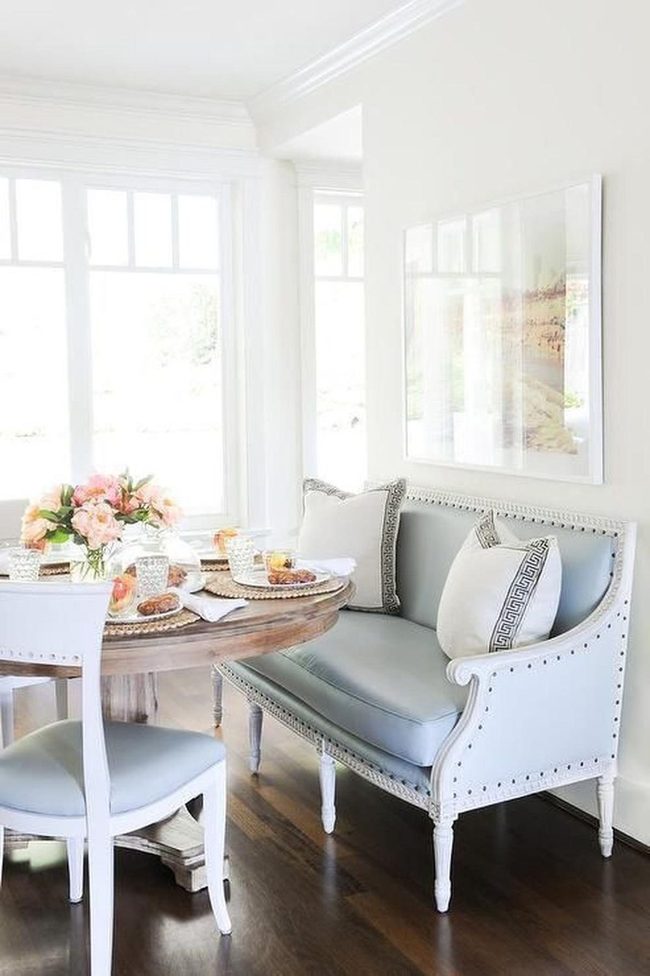 Sunlit Dining Nook With Blue Cushions