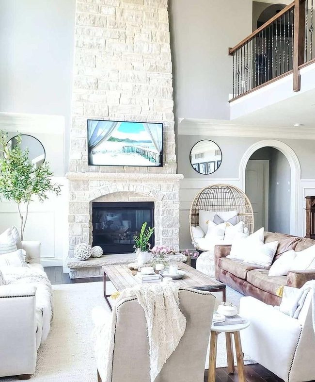 Floor-To-Ceiling Stone Fireplace Statement