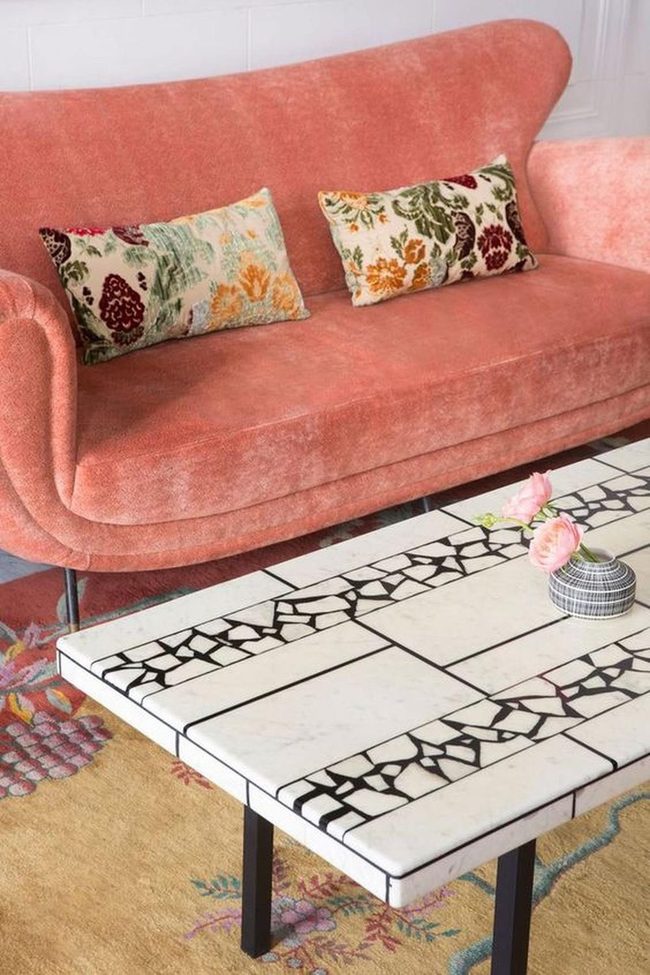 Pink Sofa With Colorful Floral Pillows