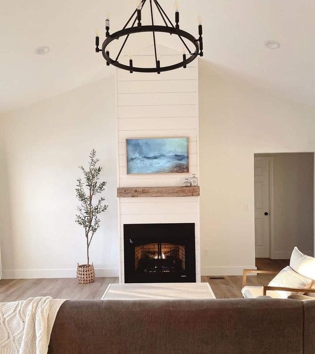 Ivory Shiplap Fireplace With Blue Statement Art