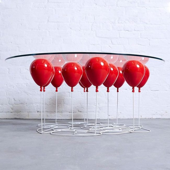 Red Balloons Hold Glass Aloft