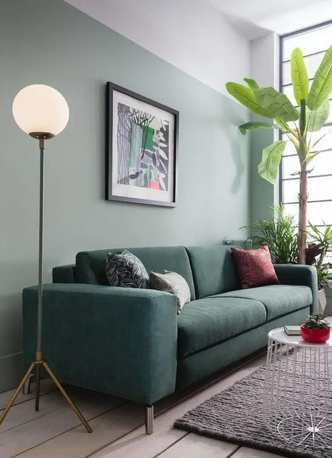 Green Sofa With Living Plant Accents