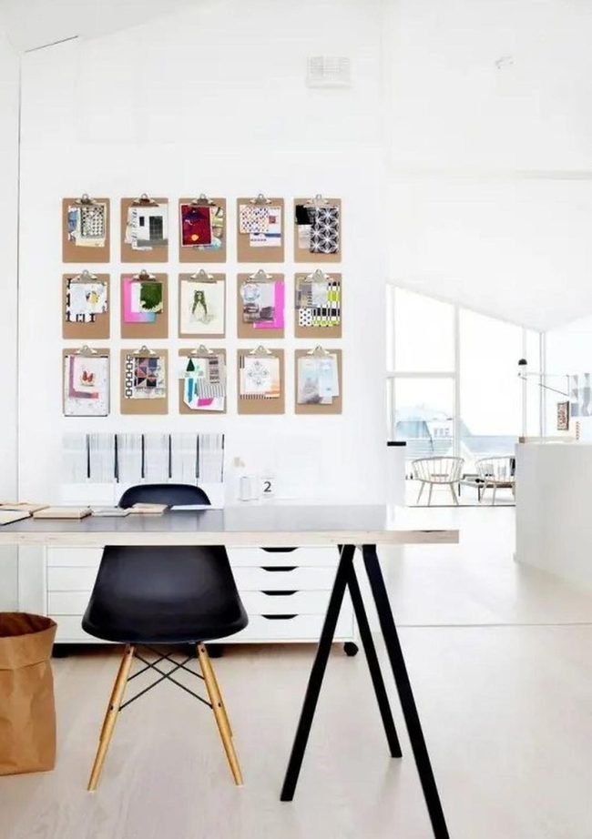 Sunlit White Space With Black Desk