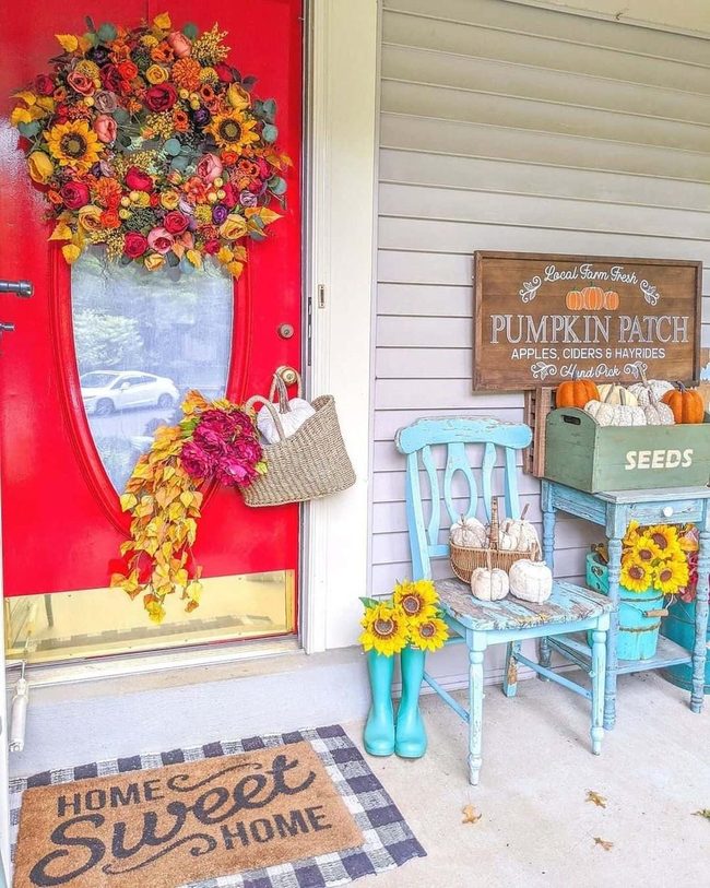 Crimson Door With Abundant Floral Wreath