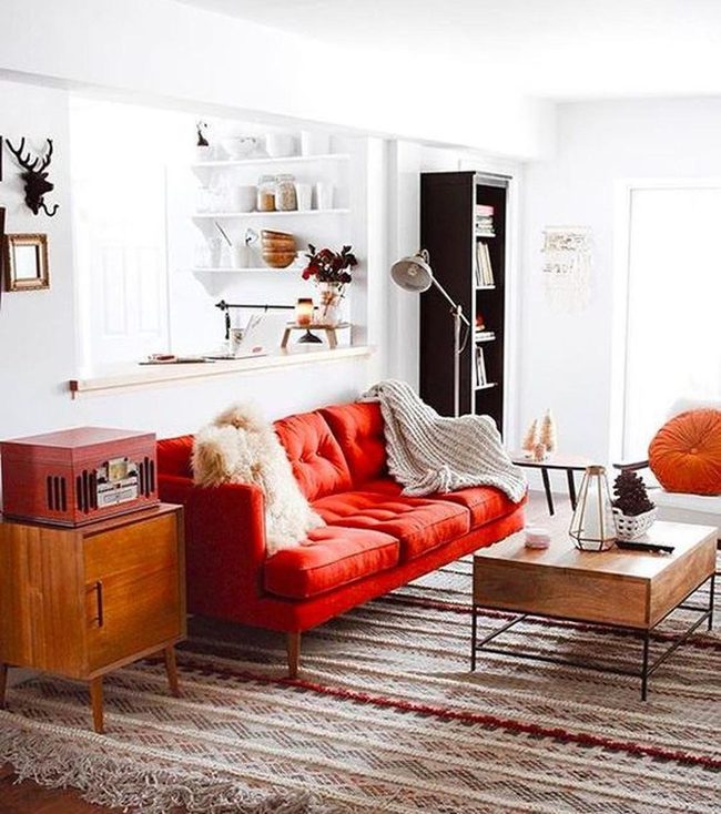 Red Sofa Anchors Bright Living Room