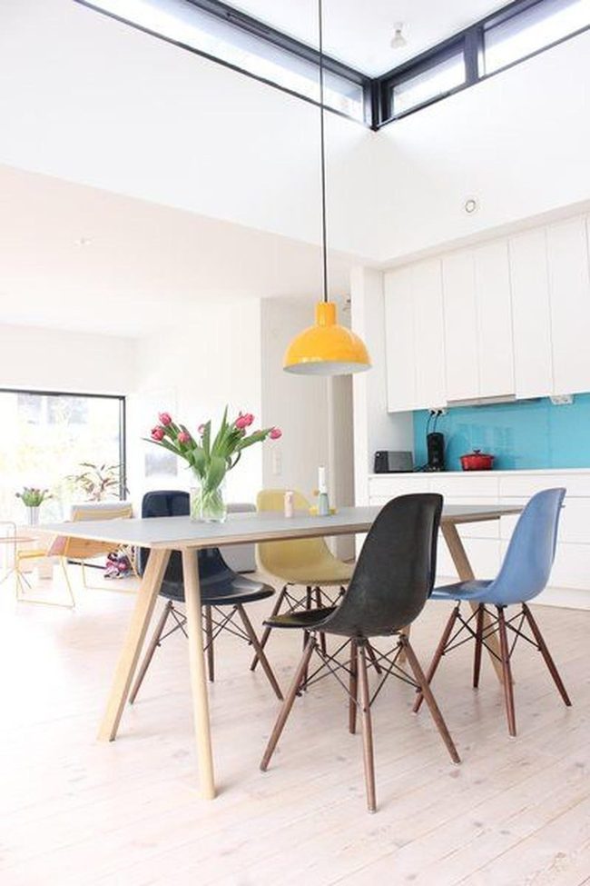 Colorful Chairs, Sunlit Wood Table