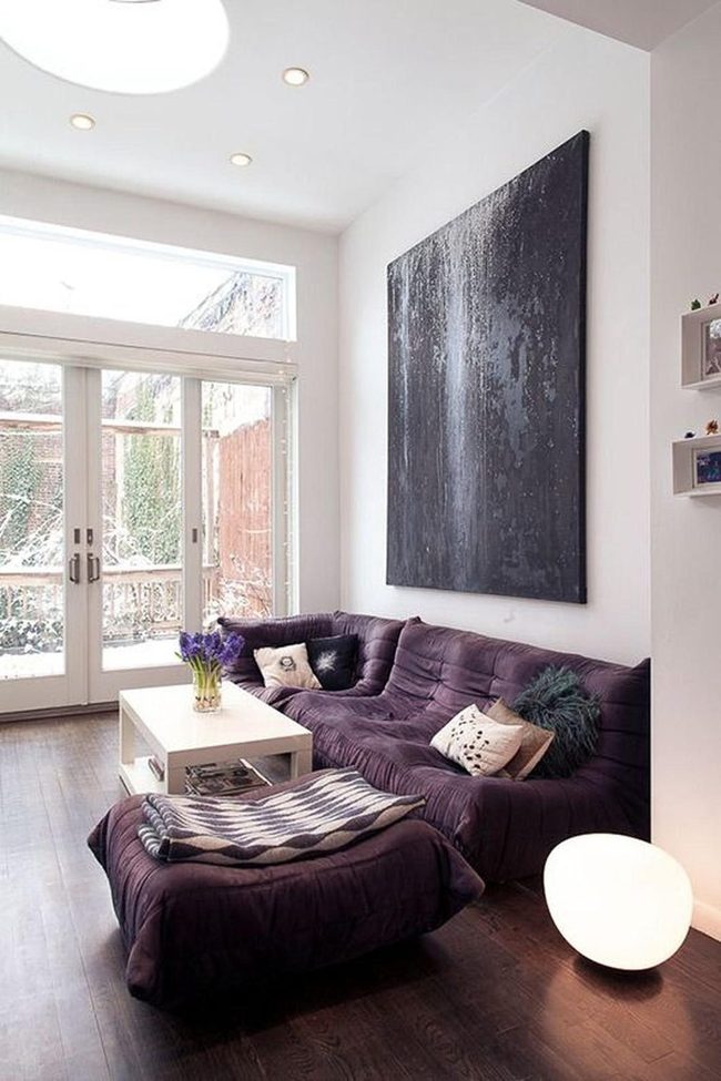 Black Textured Art Over Neutral Sofa
