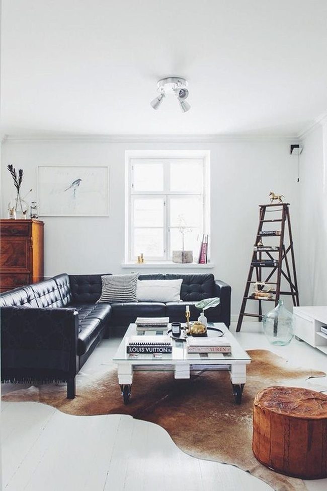 Black Leather Sofa, Earthy Hide Rugs