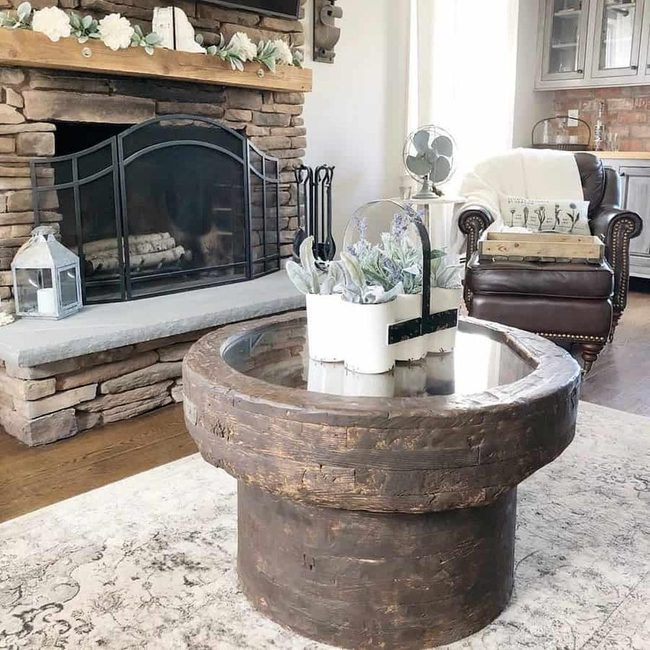 Brown Glass Table With White Plants