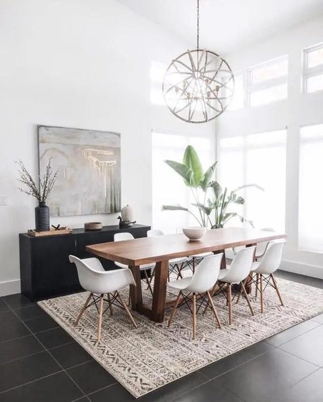 Circular Metal Chandelier Above Wooden Table
