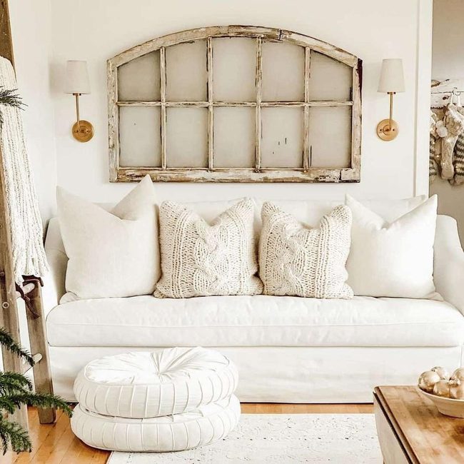White Poufs, Gold Sconces, Natural Wood