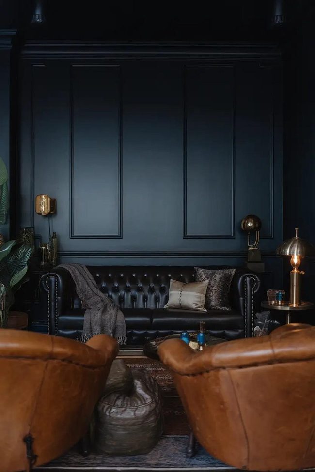 Black Couch Deep Navy Walls