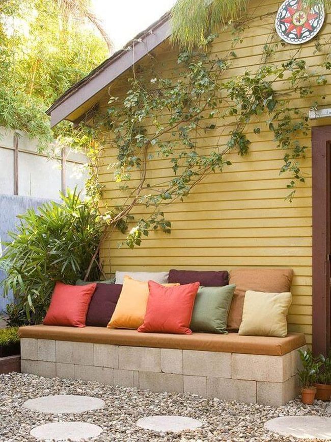 Stone Wall Seating With Jewel Tones