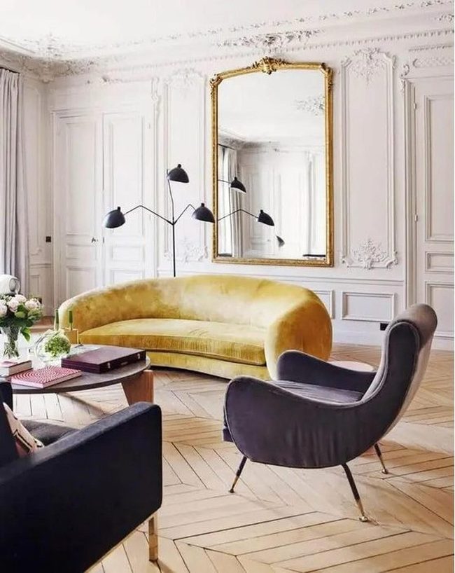 Gold Mirror Above Yellow Sofa