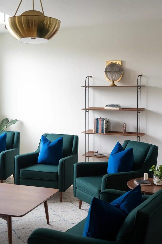 Dark Green Armchairs With Brass Lighting