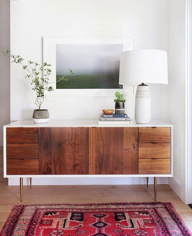 White Foyer With Colorful Rug Storage