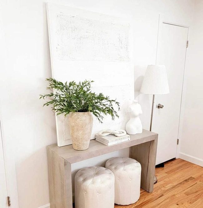 Light Wood Entry With Earthy Pottery Accents