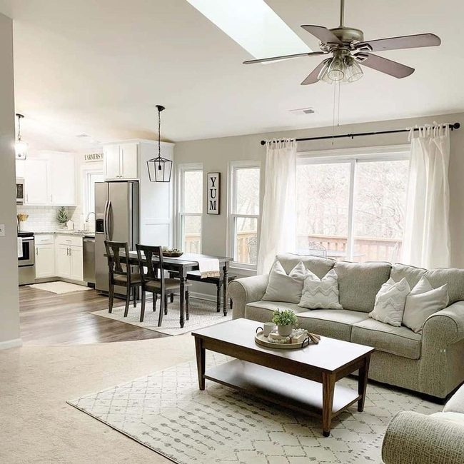 Curved Beige Carpet Connects Living Spaces