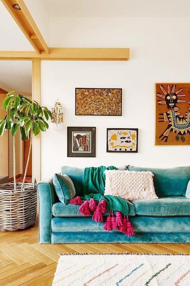 Teal Velvet Sofa With Earthy Art