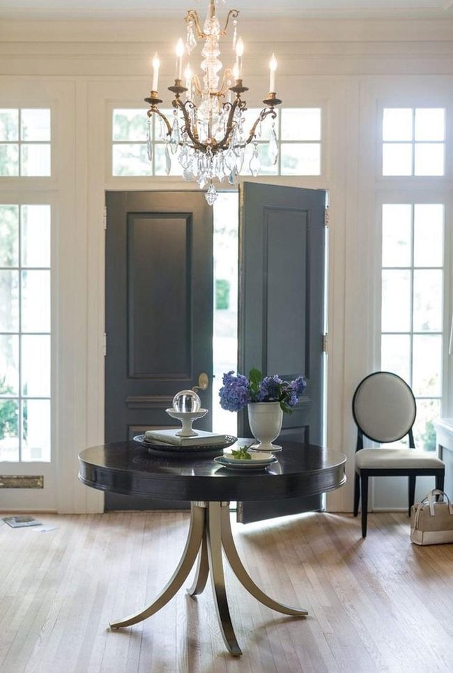 Chandelier Elegance Meets Round Tables