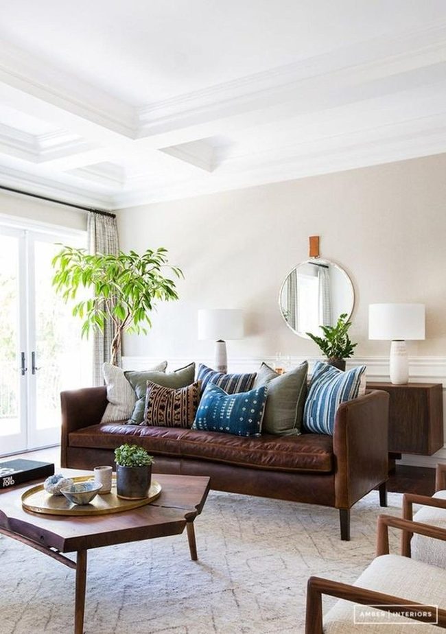 Brown Leather Sofa With Blue Patterned Pillows