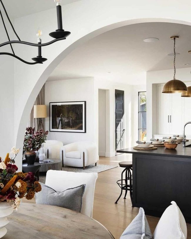Curved Archway Divides Modern Living