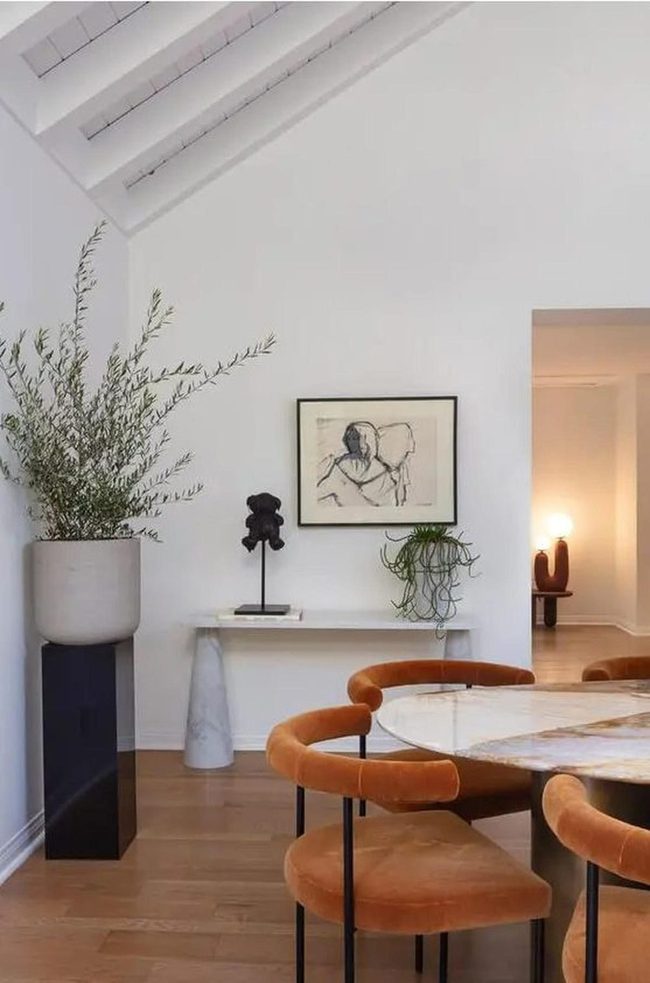Orange Chairs Meet Marble Minimalism