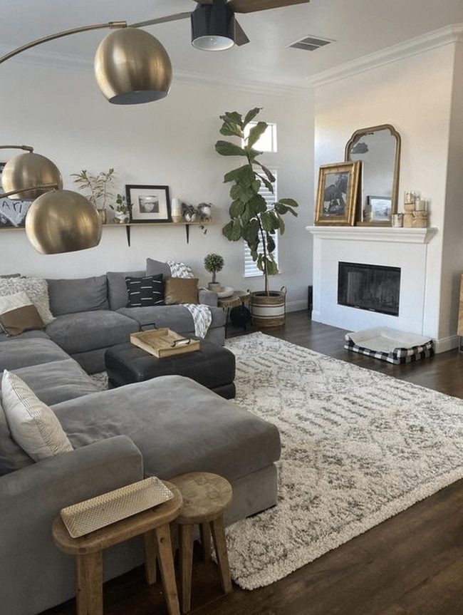Gray Sectional With Brass Uplighting