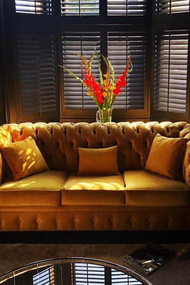 Gold Sofa Meets Red Flowers