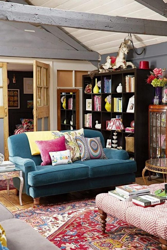 Bold Blue Couches With Red Patterned Rug