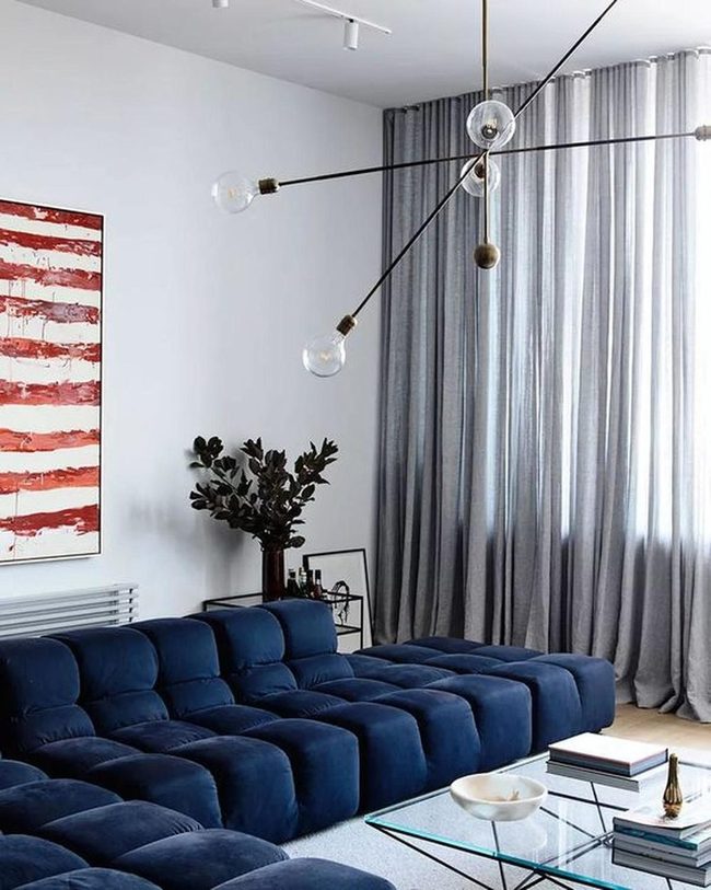 Deep Blue Sofa Anchors Modern Space