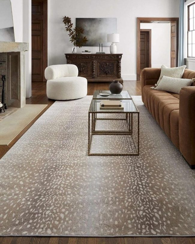 Brown Sofa With White Rounded Chairs