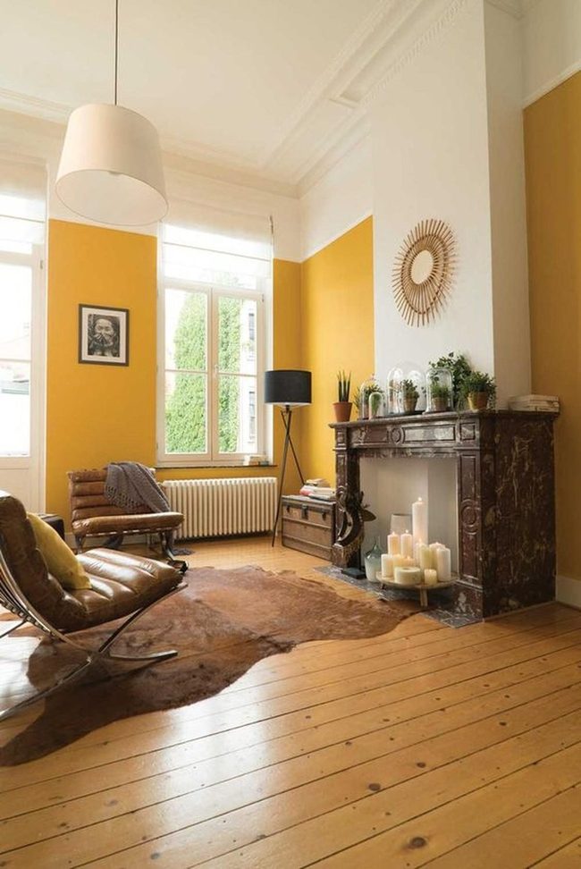 Sunburst Mirror Above Warm Fireplace
